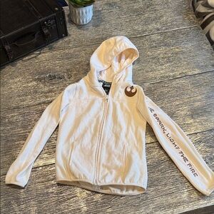 Star Wars from Galaxy’s Edge Cream Hoodie with Logo and Text kids size medium.